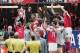 CARDIFF, UNITED KINGDOM - MAY 21: Arsenal captain, Patrick Vieira, holds the trophy aloft as team mates celebrate after winning the FA Cup Final between Arsenal and Manchester United 5-4 on penalty's at The Millennium Stadium on May 21, 2005 in Cardiff, W