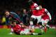 LONDON, ENGLAND - FEBRUARY 19: Mario Goetze of Bayern Muenchen clashes with Mathieu Flamini and Bacary Sagna of Arsenal during the UEFA Champions League Round of 16 first leg match between Arsenal and FC Bayern Muenchen at Emirates Stadium on February 19