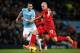 MANCHESTER, ENGLAND - DECEMBER 26: Martin Skrtel of Liverpool steers the ball clear of Alvaro Negredo of Manchester City during the Barclays Premier League match between Manchester City and Liverpool at the Etihad Stadium on December 26, 2013 in Manchest