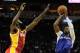 HOUSTON, TX - MARCH 29: Chris Paul #3 of the Los Angeles Clippers shoots over James Harden #13 of the Houston Rockets during the game at the Toyota Center on March 29, 2014 in Houston, Texas. NOTE TO USER: User expressly acknowledges and agrees that, by