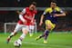 LONDON, ENGLAND - MARCH 25: Santi Cazorla of Arsenal is closed down by Neil Taylor of Swansea City during the Barclays Premier League match between Arsenal and Swansea City at Emirates Stadium on March 25, 2014 in London, England. (Photo by Julian Finne