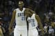 Mar 31, 2014; Charlotte, NC, USA; Charlotte Bobcats guard Kemba Walker (15) celebrates with center Al Jefferson (25) during the second half against the Washington Wizards at Time Warner Cable Arena. Bobcats defeated the Wizards 100-94. Mandatory Credit: J
