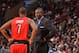 PHILADELPHIA, PA - NOVEMBER 20: Dwane Casey of the Toronto Raptors speaks with Kyle Lowry #7 during the game against the Philadelphia 76ers at the Wells Fargo Center on November 20, 2013 in Philadelphia, Pennsylvania. NOTE TO USER: User expressly acknowl