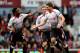 LONDON, ENGLAND - APRIL 06: Steven Gerrard (C)of Liverpool celebrates with teammate Raheem Sterling (L) after scoring the opening goal from the penalty spot during the Barclays Premier League match between West Ham United and Liverpool at Boleyn Ground o