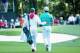 AUGUSTA, GA - APRIL 09: Rory McIlroy of Northern Ireland alongside his caddie/girlfriend Caroline Wozniacki during the 2014 Par 3 Contest prior to the start of the 2014 Masters Tournament at Augusta National Golf Club on April 9, 2014 in Augusta, Georgia