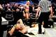 Batista towers over his fallen foes, Randy Orton and Daniel Bryan.