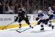 LOS ANGELES, CA - MAY 10: Trevor Lewis #22 of the Los Angeles Kings skates with the puck against Roman Polak #46 of the St. Louis Blues in Game Six of the Western Conference Quarterfinals during the 2013 NHL Stanley Cup Playoffs at Staples Center on May