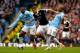 MANCHESTER, ENGLAND - APRIL 05: Jay Rodriguez of Southampton is challenged by Yaya Toure (L) and Fernandinho (R) of Manchester City during the Barclays Premier League match between Manchester City and Southampton at Etihad Stadium on April 5, 2014 in Man
