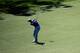 AUGUSTA, GA - APRIL 10: Dustin Johnson of the United States hits his second shot on the ninth hole during the first round of the 2014 Masters Tournament at Augusta National Golf Club on April 10, 2014 in Augusta, Georgia. (Photo by Rob Carr/Getty Images