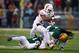Dec 7, 2013; Waco, TX, USA; Texas Longhorns running back Malcolm Brown (28) tries to elude Baylor Bears linebacker Brody Trahan (15) and cornerback K.J. Morton (8) during the second quarter at Floyd Casey Stadium. Mandatory Credit: Jerome Miron-USA TODAY