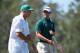 AUGUSTA, GA - APRIL 10: Adam Scott of Australia and caddie Steve Williams wait on a green during the first round of the 2014 Masters Tournament at Augusta National Golf Club on April 10, 2014 in Augusta, Georgia. (Photo by Harry How/Getty Images)