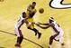Jun 3, 2013; Miami, FL, USA; Indiana Pacers small forward Paul George (24) passes against Miami Heat center Chris Bosh (1) and small forward LeBron James (6) during the third quarter of game 7 of the 2013 NBA Eastern Conference Finals at American Airlines