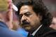 ST LOUIS, MO- OCTOBER 6: Jacksonville Jaguars and Fulham FC owner, Shahid Khan, listens intensely as he speaks with fans on the sideline prior to Sunday's football game between the Jacksonville Jaguars and the St. Louis Rams at the Edward Jones Dome on
