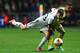 SWANSEA, WALES - FEBRUARY 20: Ben Davies (L) of Swansea City is held back by Dries Mertens (R) of SSC Napoli during the UEFA Europa League Round of 32 First Leg match between Swansea City and SSC Napoli at the Liberty Stadium on February 20, 2014 in Swan