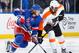 NEW YORK, NY - MARCH 26: Carl Hagelin #62 of the New York Rangers skates against Wayne Simmonds #17 of the Philadelphia Flyers at Madison Square Garden on March 26, 2014 in New York City. (Photo by Scott Levy/NHLI via Getty Images)