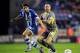 WIGAN, ENGLAND - APRIL 01: Jordi Gomez (L) of Wigan Athletic in action with Gary Taylor-Fletcher of Leicester City during the Sky Bet Championship match between Wigan Athletic and Leicester City at DW Stadium on April 01, 2014 in Wigan, England. (Photo by