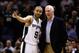 Mar 26, 2014; San Antonio, TX, USA; San Antonio Spurs guard Tony Parker (9) talks with head coach Gregg Popovich during the second half against the Denver Nuggets at AT&T Center. Mandatory Credit: Soobum Im-USA TODAY Sports