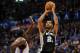 Apr 3, 2014; Oklahoma City, OK, USA; San Antonio Spurs forward Tim Duncan (21) attempts a shot against Oklahoma City Thunder center Kendrick Perkins (5) during the third quarter at Chesapeake Energy Arena. Mandatory Credit: Mark D. Smith-USA TODAY Sports