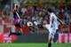 SEVILLE, SPAIN - AUGUST 14: Jonathan (L) of Barcelona is challenged by Federico Fazio of Sevilla during the Supercopa first leg match between Sevilla and Barcelona at the Sanchez Pizjuan stadium on August 14, 2010 in Seville, Spain. (Photo by Denis Doy