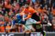 GLASGOW, SCOTLAND - APRIL 12: Lee McCulloch of Rangers and Nadir Ciftci of Dundee United collide during the William Hill Scottish Cup Semi Final between Rangers and Dundee United at Ibrox Stadium on April 12, 2014 in Glasgow, Scotland. (Photo by Mark Runn