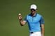 Apr 12, 2014; Augusta, GA, USA; Rory McIlroy holds up his ball after making a putt on the 2nd green during the third round of the 2014 The Masters golf tournament at Augusta National Golf Club. Mandatory Credit: Jack Gruber-USA TODAY Sports