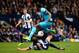 WEST BROMWICH, ENGLAND - APRIL 12: Emmanuel Adebayor of Spurs is tackled by Jonas Olsson of West Bromwich during the Barclays Premier League match between West Bromwich Albion and Tottenham Hotspur at The Hawthorns on April 12, 2014 in West Bromwich, Eng