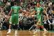 BOSTON, MA - MARCH 14: Rajon Rondo #9 and Avery Bradley #0 of the Boston Celtics high five after the play against the Phoenix Suns on March 14, 2014 at the TD Garden in Boston, Massachusetts. NOTE TO USER: User expressly acknowledges and agrees that, by