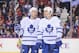 CALGARY, AB - OCTOBER 30: David Clarkson #71 and Dave Bolland #63 of the Toronto Maple Leafs confer between play against the Calgary Flames during an NHL game at Scotiabank Saddledome on October 30, 2013 in Calgary, Alberta, Canada. (Photo by Derek Leung