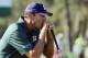 Apr 10, 2014; Augusta, GA, USA; Matt Kuchar reacts after missing a birdie attempt on the 17th hole during the first round of the 2014 The Masters golf tournament at Augusta National Golf Club. Mandatory Credit: Michael Madrid-USA TODAY Sports