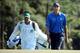 AUGUSTA, GA - APRIL 12: Matt Kuchar of the United States walks to the 18th green with his caddie Lance Bennett during the third round of the 2014 Masters Tournament at Augusta National Golf Club on April 12, 2014 in Augusta, Georgia. (Photo by Andrew Re