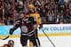 PHILADELPHIA, PA - APRIL 12: Daniel Carr #9 of the Union College Dutchmen celebrates a teammate's goal as Adam Wilcox #32 of the Minnesota Golden Gophers looks on during the 2014 NCAA Division I Men's Hockey Championship Game at Wells Fargo Center on Apr