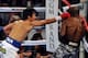 LAS VEGAS, NV - APRIL 12: Manny Pacquiao (L) and Timothy Bradley fight during their WBO world welterweight championship boxing match at the MGM Grand Garden Arena on April 12, 2014 in Las Vegas, Nevada. (Photo by David Becker/Getty Images)