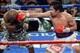 Apr 12, 2014; Las Vegas, NV, USA; Timothy Bradley (green gloves) and Manny Pacquiao (red gloves) box during their WBO World Welterweight Title bout at MGM Grand Garden Arena. Pacquiao won via unanimous decision. Mandatory Credit: Joe Camporeale-USA TODAY