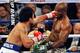 LAS VEGAS, NV - APRIL 12: Manny Pacquiao (L) and Timothy Bradley battle it out during their WBO world welterweight championship boxing match at the MGM Grand Garden Arena on April 12, 2014 in Las Vegas, Nevada. Pacquiao won by unanimous decision. (Photo