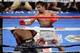 Apr 12, 2014; Las Vegas, NV, USA; Timothy Bradley (green gloves) and Manny Pacquiao (red gloves) box during their WBO World Welterweight Title bout at MGM Grand Garden Arena. Pacquiao won via unanimous decision. Mandatory Credit: Joe Camporeale-USA TODAY