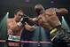 LAS VEGAS, NV - OCTOBER 12: WBO welterweight champion Timothy Bradley Jr. (R) lands a left jab ot the head of Juan Manuel Marquez during their bout at the Thomas & Mack Center on October 12, 2013 in Las Vegas, Nevada. Timothy Bradley Jr. wins in a split-