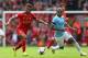 LIVERPOOL, ENGLAND - APRIL 13: Raheem Sterling of Liverpool competes with Fernandinho of Manchester City during the Barclays Premier League match between Liverpool and Manchester City at Anfield on April 13, 2014 in Liverpool, England. (Photo by Alex Li