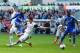 SWANSEA, WALES - APRIL 13: Demba Ba of Chelsea takes a shot on goal as Ben Davies of Swansea slides in during the Barclays Premier League match between Swansea City and Chelsea at Liberty Stadium on April 13, 2014 in Swansea, Wales. (Photo by Michael St