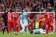 LIVERPOOL, ENGLAND - APRIL 13: Jordan Henderson of Liverpool is shown a red card by Referee Mark Clattenburg during the Barclays Premier League match between Liverpool and Manchester City at Anfield on April 13, 2014 in Liverpool, England. (Photo by Ale