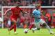 LIVERPOOL, ENGLAND - APRIL 13: Raheem Sterling of Liverpool competes with Fernandinho of Manchester City during the Barclays Premier League match between Liverpool and Manchester City at Anfield on April 13, 2014 in Liverpool, England. (Photo by Alex Li