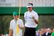 AUGUSTA, GA - APRIL 13: Bubba Watson of the United States celebrates on the 17th green as his caddie Ted Scott looks on after winning the 2014 Masters Tournament by a three-stroke margin at Augusta National Golf Club on April 13, 2014 in Augusta, Georgia
