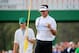 AUGUSTA, GA - APRIL 13: Bubba Watson of the United States celebrates on the 17th green as his caddie Ted Scott looks on after winning the 2014 Masters Tournament by a three-stroke margin at Augusta National Golf Club on April 13, 2014 in Augusta, Georgia