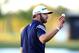 Mar 8, 2014; Miami, FL, USA; Dustin Johnson acknowledges the crowd on the 18th green during the third round of the WGC - Cadillac Championship golf tournament at TPC Blue Monster at Trump National Doral. Mandatory Credit: Andrew Weber-USA TODAY Sports