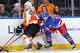 NEW YORK, NY - MARCH 26: Brad Richards #19 of the New York Rangers battles for the puck against Andrew MacDonald #47 of the Philadelphia Flyers at Madison Square Garden on March 26, 2014 in New York City. The New York Rangers won 3-1. (Photo by Scott Levy