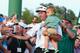 AUGUSTA, GA - APRIL 13: Bubba Watson of the United States holds his son Caleb on the 18th green after winning the 2014 Masters Tournament by a three-stroke margin at Augusta National Golf Club on April 13, 2014 in Augusta, Georgia. during the final round