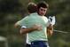 Apr 13, 2014; Augusta, GA, USA; Bubba Watson (rear) hugs Jordan Spieth after winning the 2014 The Masters golf tournament at Augusta National Golf Club. Mandatory Credit: Michael Madrid-USA TODAY Sports