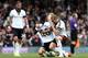 LONDON, ENGLAND - APRIL 12: Hugo Rodallega of Fulham celebrates the teams win with Lewis Holtby and Pajtim Kasami at the final whistle during the Barclays Premier League match between Fulham and Norwich City at Craven Cottage on April 12, 2014 in London,