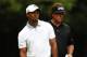 NORTON, MA - AUGUST 31: Tiger Woods and Phil Mickelson of the USA react on the 11th tee during the second round of the Deutsche Bank Championship at TPC Boston on August 31, 2013 in Norton, Massachusetts. (Photo by Jim Rogash/Getty Images)