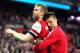 LONDON, ENGLAND - APRIL 12: Per Mertesacker and Olivier Giroud of Arsenal celebrate victory during the FA Cup Semi-Final match between Wigan Athletic and Arsenal at Wembley Stadium on April 12, 2014 in London, England. (Photo by Mike Hewitt/Getty Images