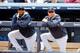 NEW YORK, NY - APRIL 12: Derek Jeter #2 (R) and CC Sabathia #52 of the New York Yankees looks on from the dugout during the first inning against the Boston Red Sox at Yankee Stadium on April 12, 2014 in the Bronx borough of New York City. (Photo by Jim
